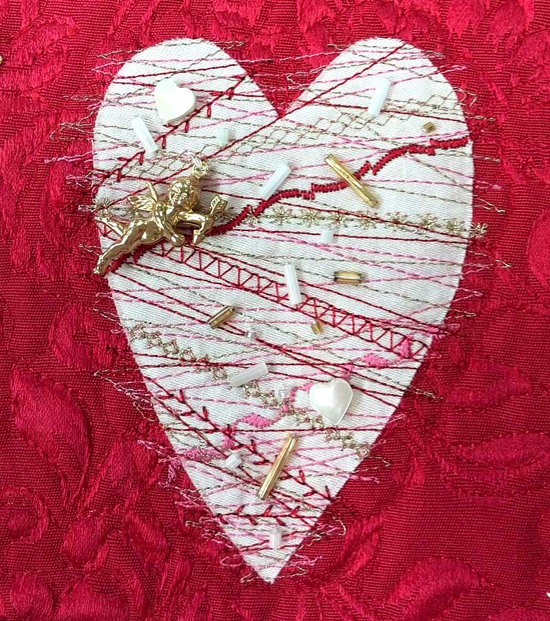 Stitched and embellished heart detail from a quilt by Diane Herbort