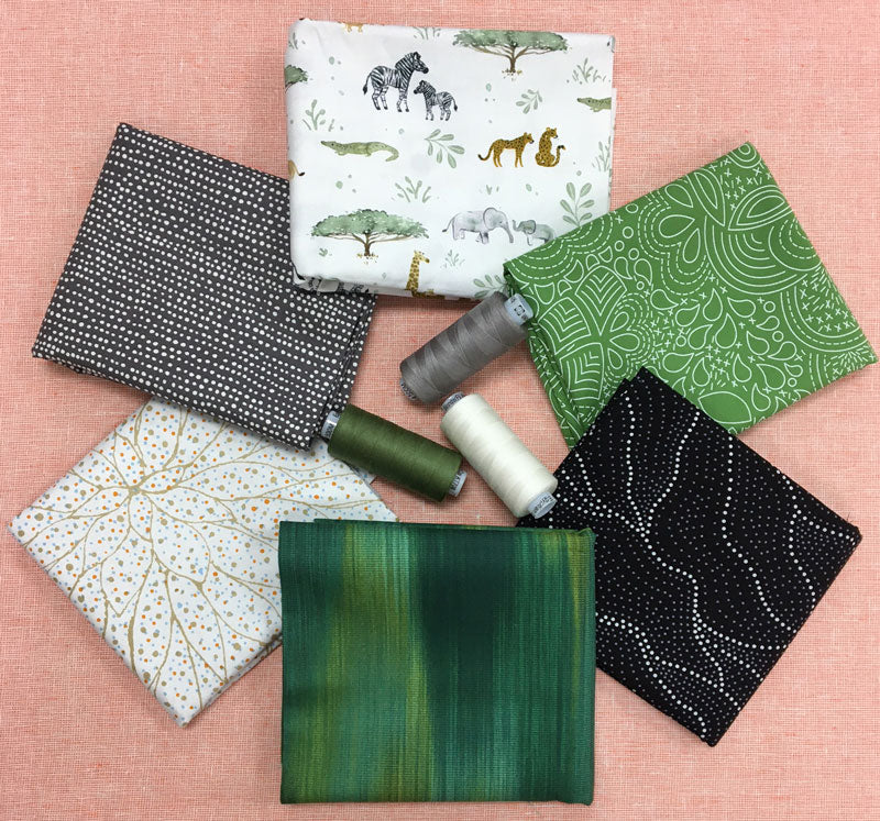 Fabrics selected by Dudley Shugart perfect for a Yellow Brick Road baby quilt.