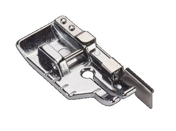 Silver sewing machine foot.