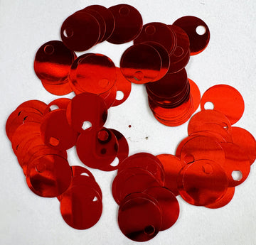 Scattered red circular sequins with holes.