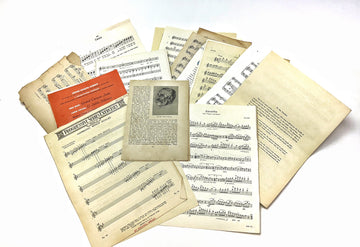 Pile of old sheet music and papers.