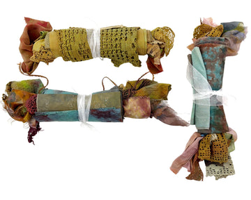 Three bundles of colorful fabric.