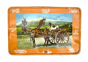 Vintage tray with horse-drawn carriage and mountain scene.