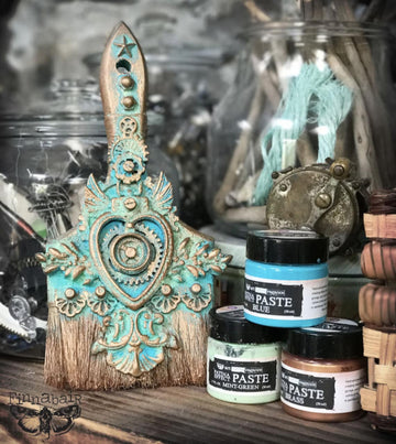 Steampunk-style brush with blue, mint, and brass paste