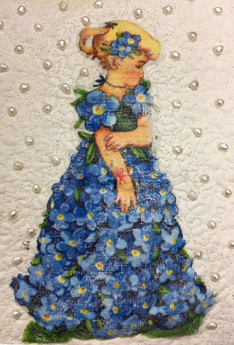 Detail of Bluebell Paper Doll, mixed media art quilt by Judy Gula of Artistic Artifacts