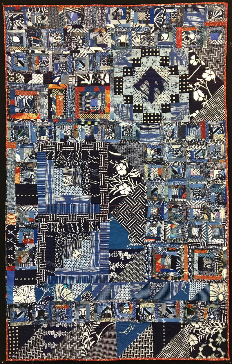 Completed Virginia’s quilt by Judy Gula including fabrics and blocks by Virginia Aribe