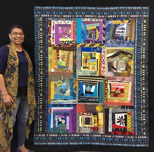 Janet Green with her improv quilt Inside Stories