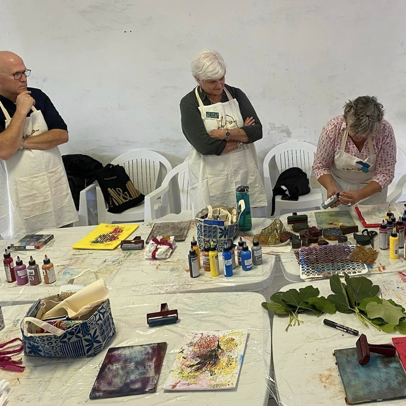 Judy Gula demonstrates monoprinting during one of her Italian Creative Retreasts