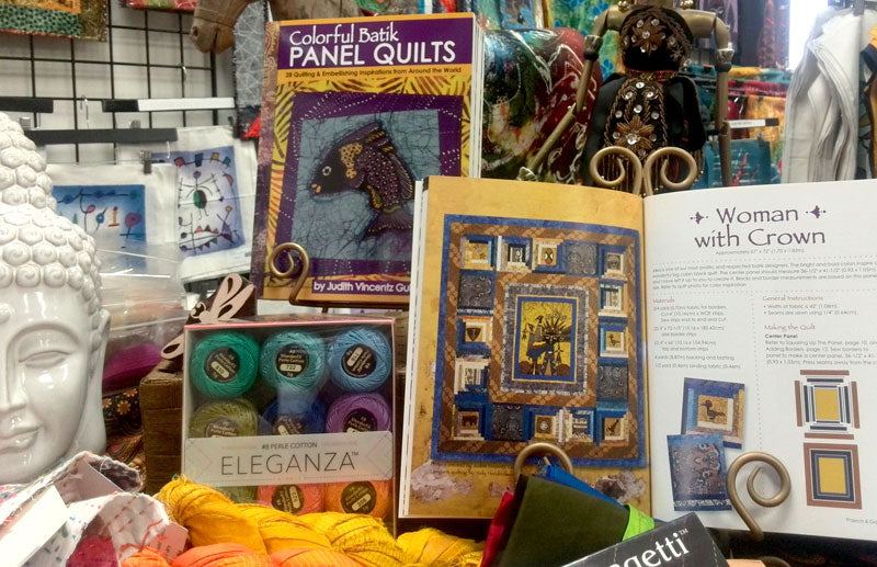Colorful Batik Panel Quilts by Judy Gula on display at Artistic Artifacts