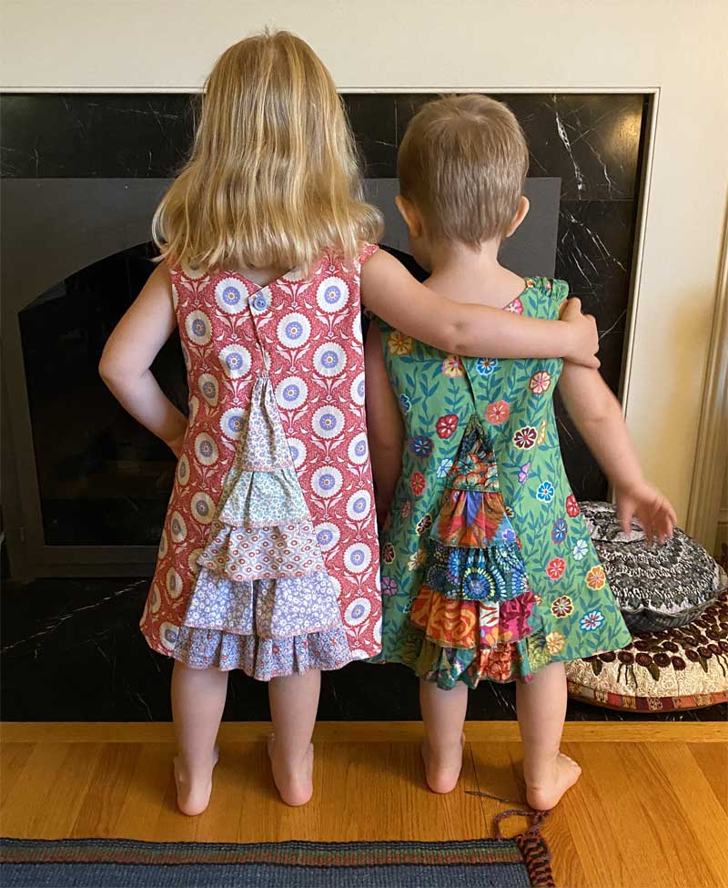 Nancy McCarthy's granddaughters in their Urban Princess dresses, showing the ruffled back