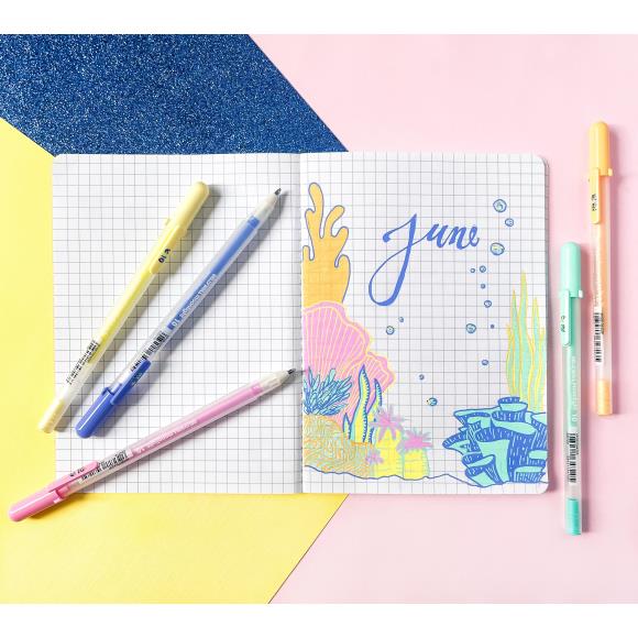 Notebook with pens and colorful drawings.