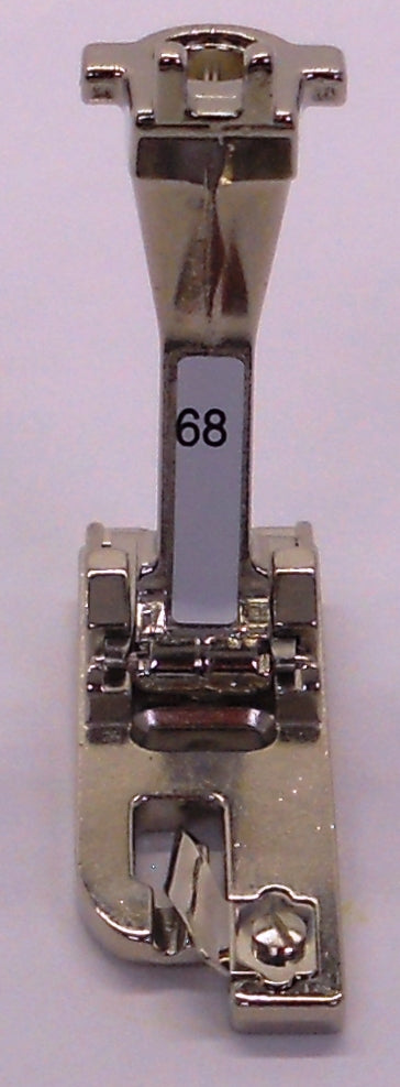 Sewing machine presser foot with 68 label.