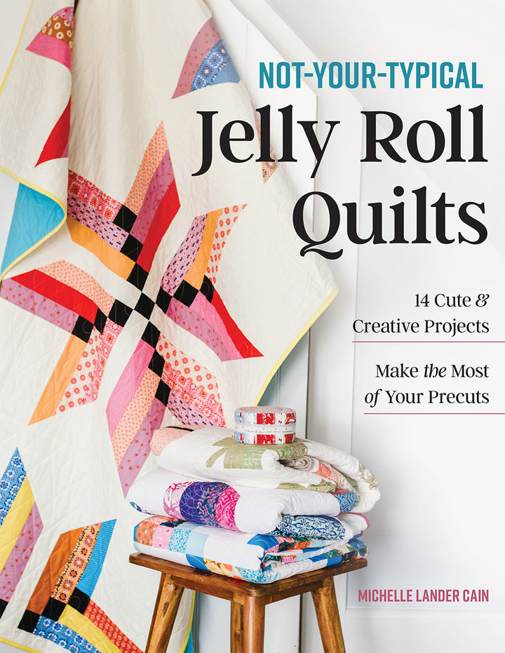 Book cover with a colorful quilt and text.