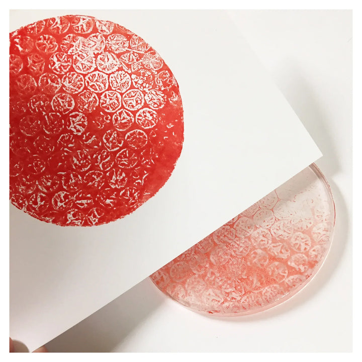 Red bubble wrap print on paper