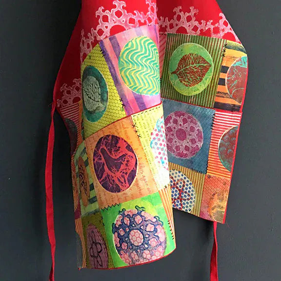 Colorful patchwork 4-round apron with decorative circles.