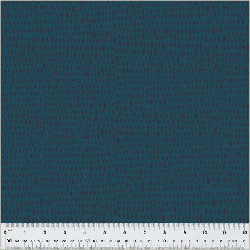 Teal fabric with small, textured pattern and ruler.
