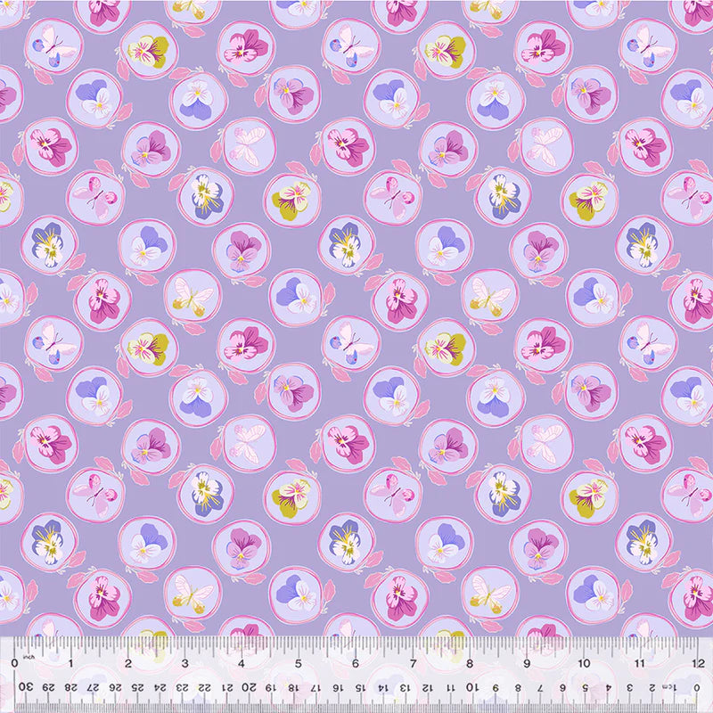 Purple floral fabric with pansies and a ruler.