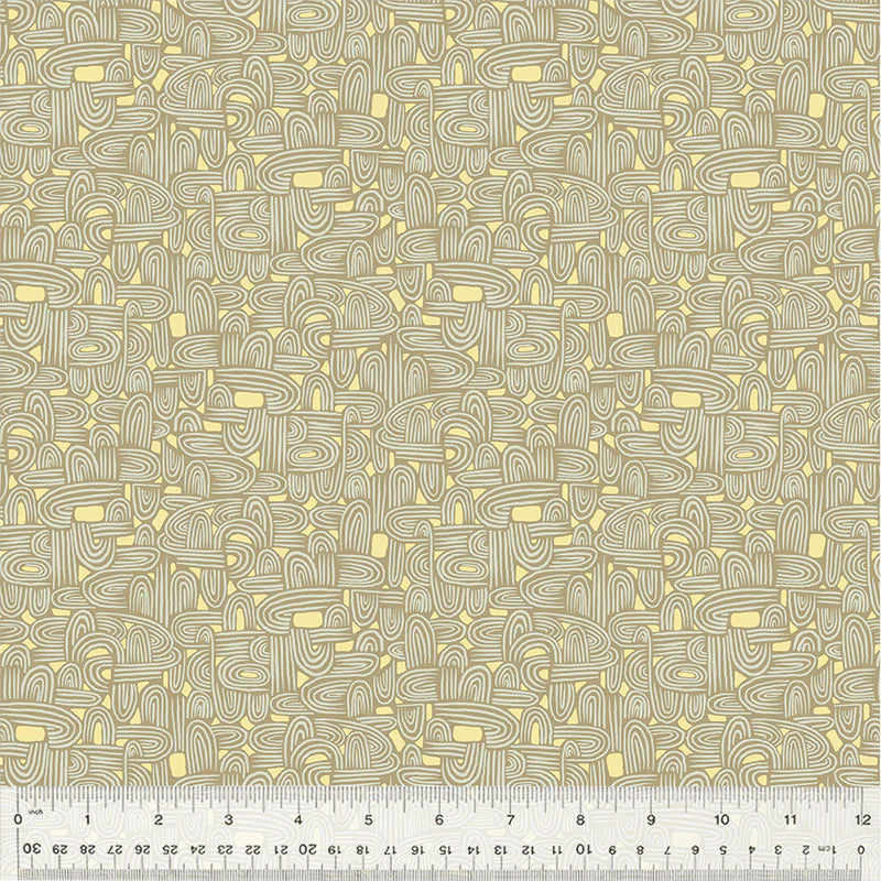 Fabric pattern with tan and yellow abstract design, ruler visible.
