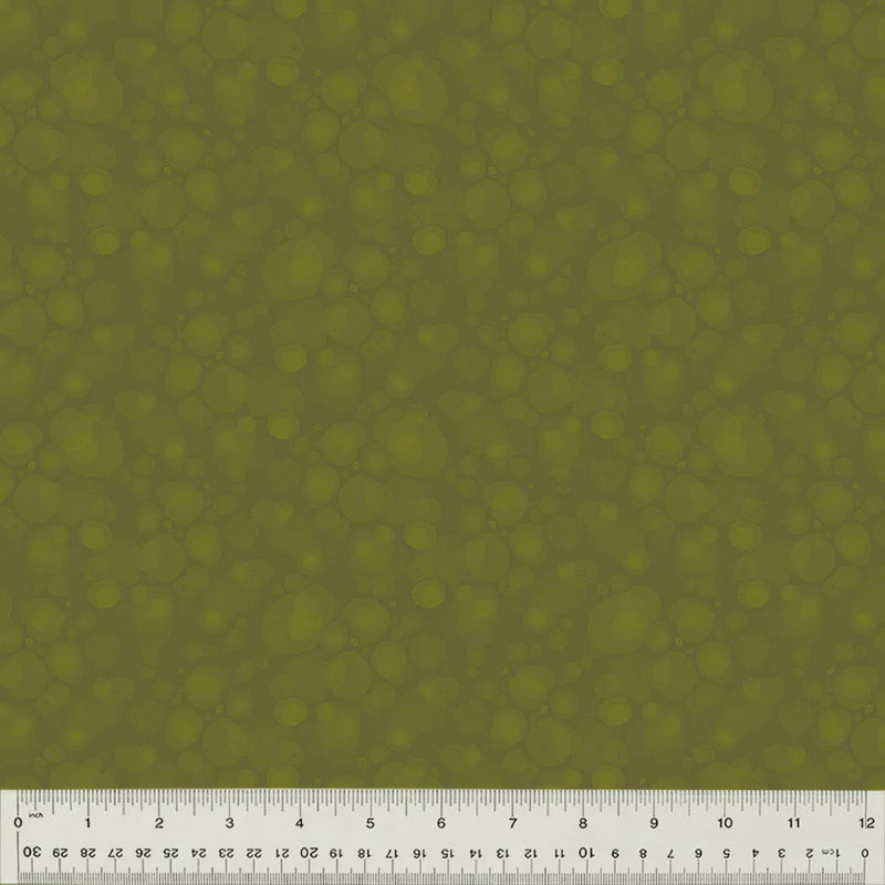 Green textured fabric with ruler
