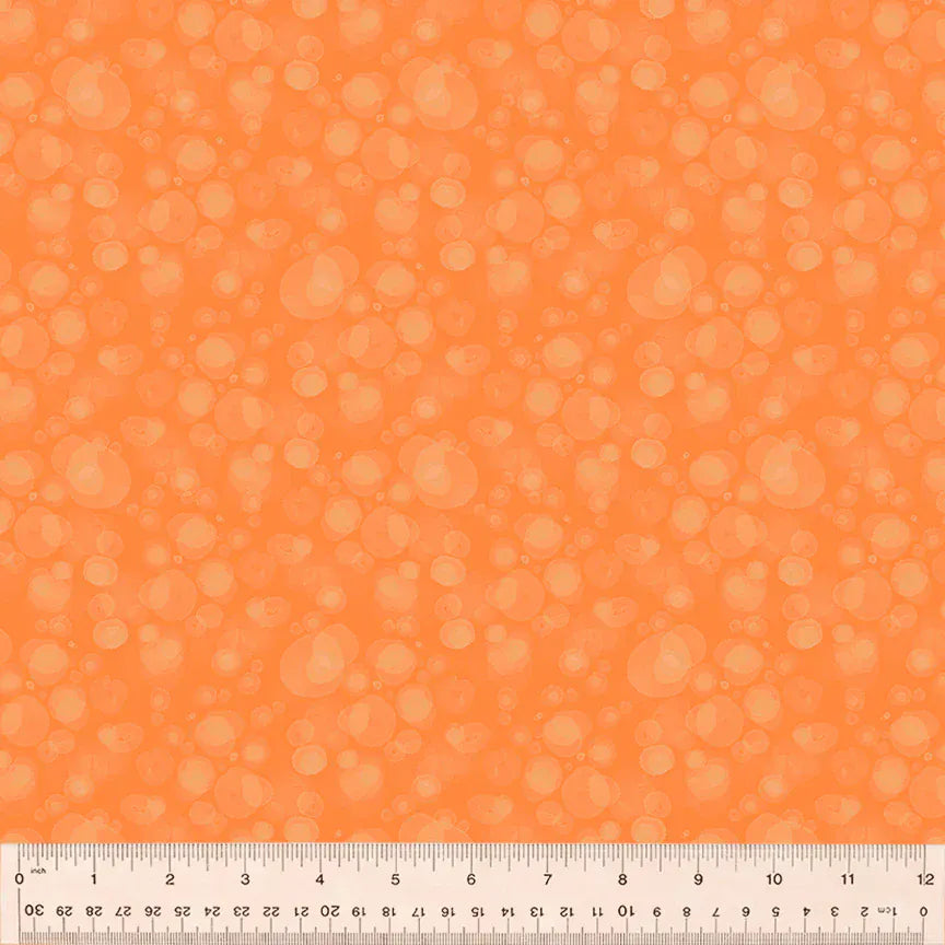 Orange fabric with bubble pattern and ruler