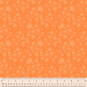 Orange fabric with bubble pattern and ruler