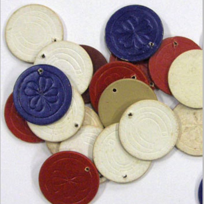 Vintage Poker Chips with drilled holes.