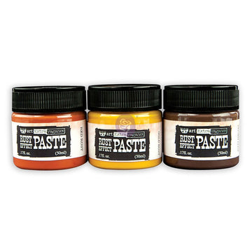 Three jars of rust paste in orange, yellow, and brown.