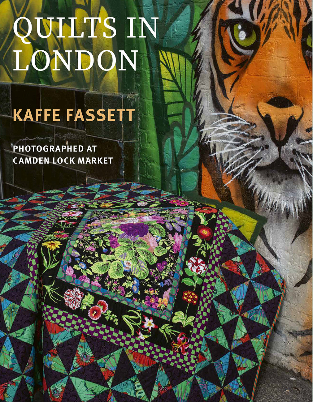 Book cover with quilt and tiger mural.