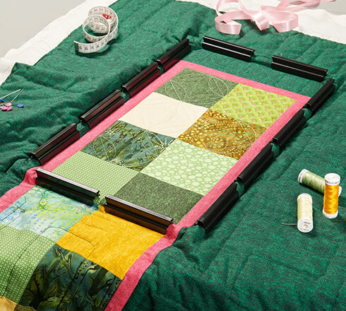 Bernina 8x16 Clamp Hoop accessory holding a quilt block.