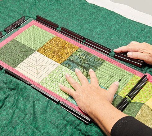Bernina 8x16 Clamp Hoop setup with fabric, viewed from above.
