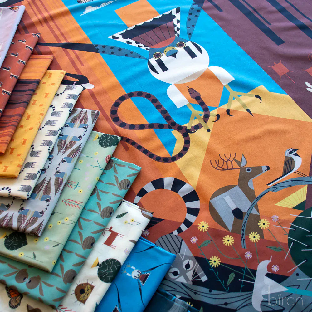 Charley Harper Canyon Country fabric with wildlife and fabric bolts.