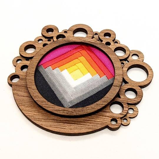 Circle brooch with colorful fabric detail