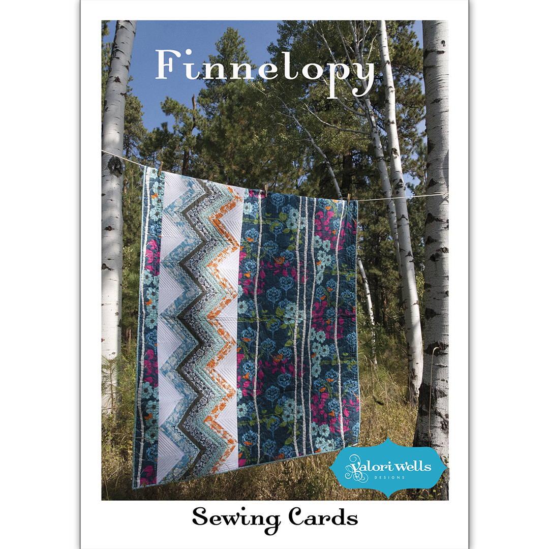 Finnelopy lap quilt pattern by Valori Wells with theme fabric panel