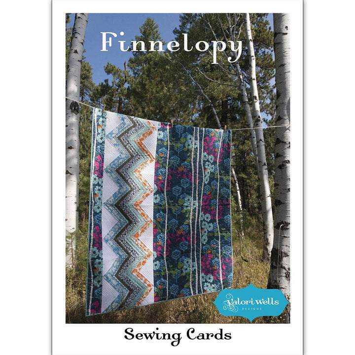 Finnelopy lap quilt pattern by Valori Wells with theme fabric panel