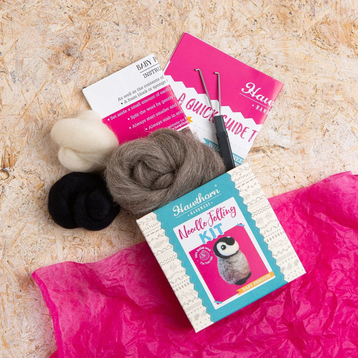 Needle felt penguin kit contents.