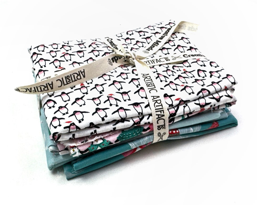 Half yard bundle of penguins and bears fabric.