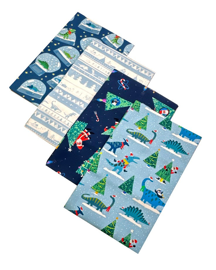 Half-yard spread of Christmas dinosaur fabric patterns.