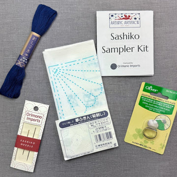 thread, needles, sampler kit, and thimble.