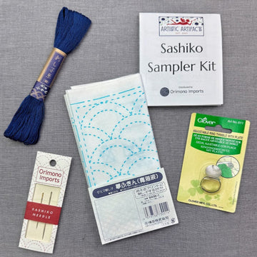 Sashiko sampler kit with thread, needles, and supplies.