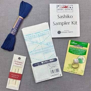 Sashiko kit with thread, needles, and fabric.