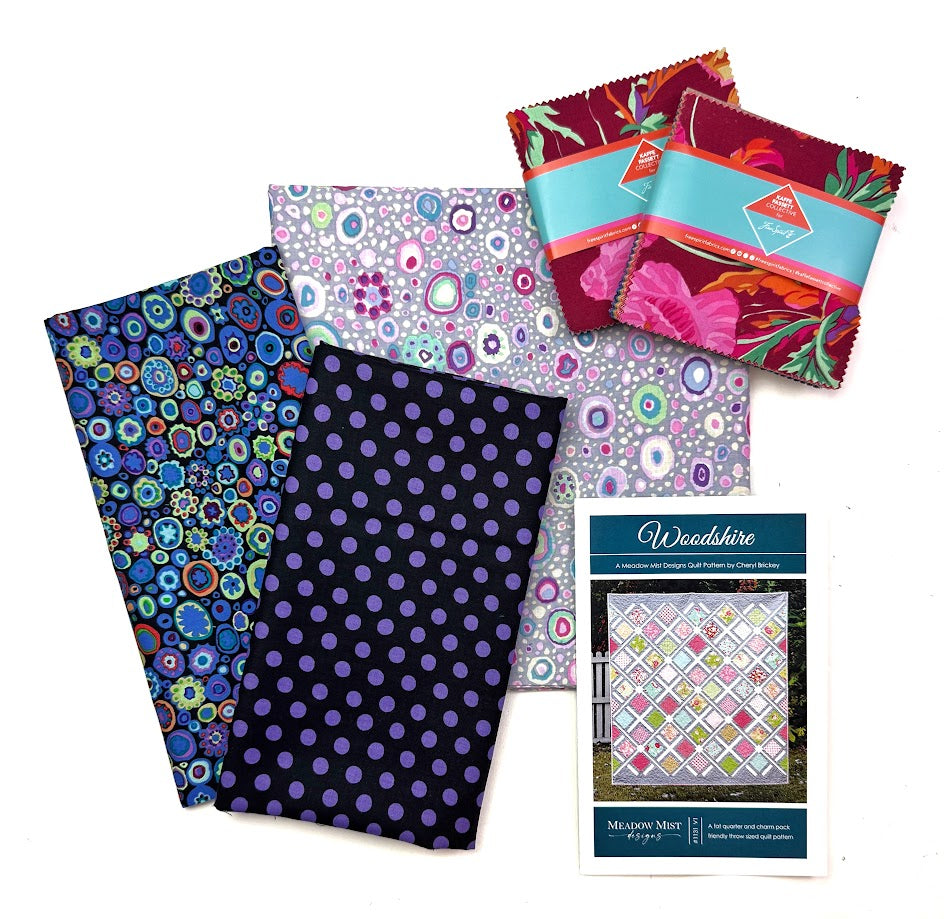 Fabric bundles and quilt pattern.
