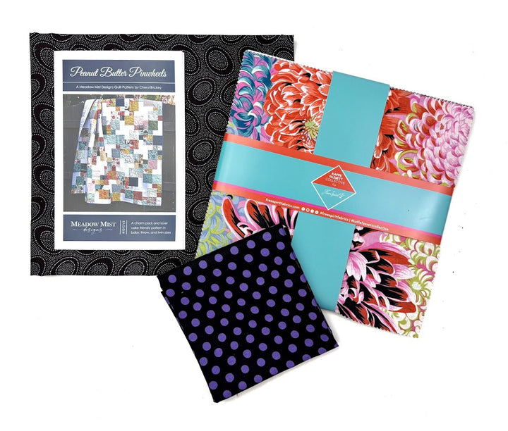 Fabric squares and a quilt pattern.