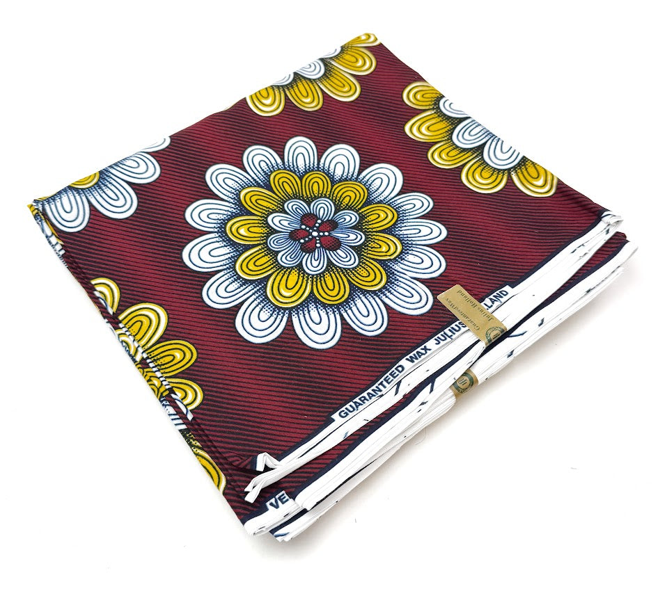 Folded red fabric with floral pattern.