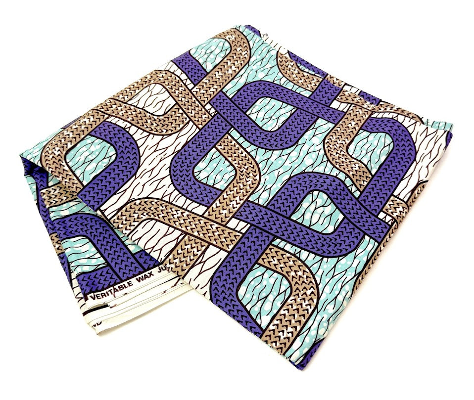 Folded fabric with geometric pattern in blue, brown, and white.