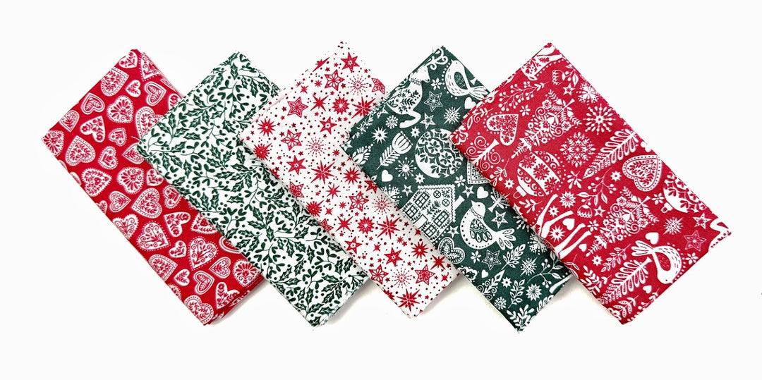 Six folded patterned fabric napkins.