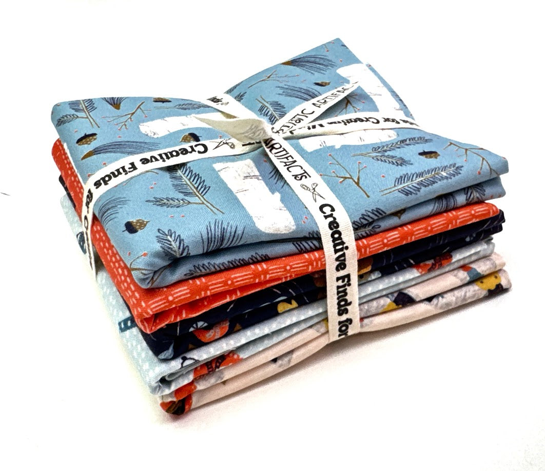Stack of fabric bundles with feather pattern