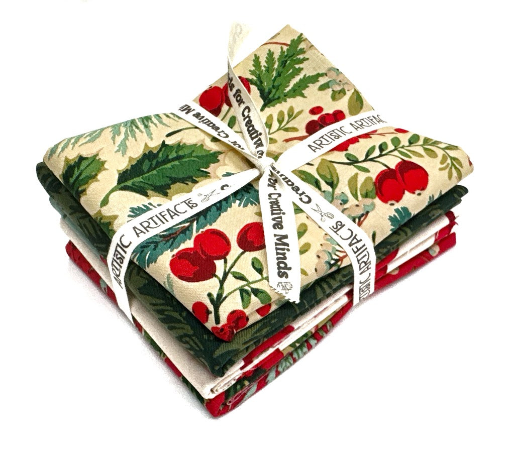 Stack of Christmas-themed fabric squares tied with ribbon.