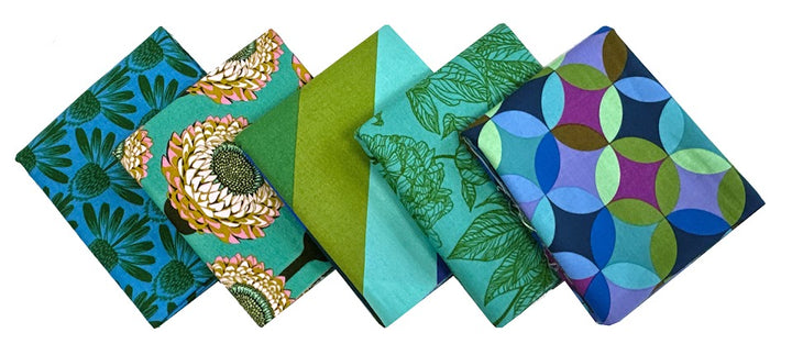 Folded fabric squares with various colorful patterns.