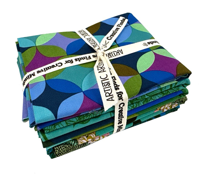 Stack of colorful fabric squares tied with a ribbon.