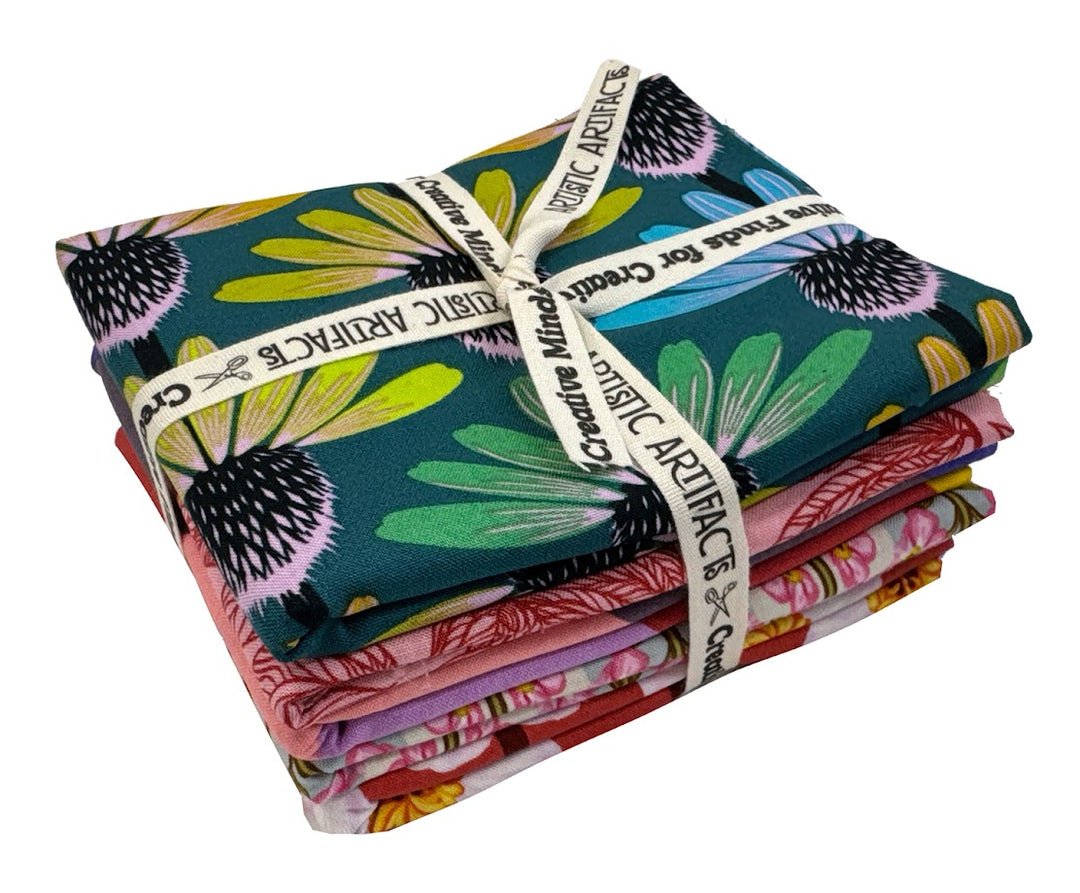 Stacked fabric bundles with floral patterns.